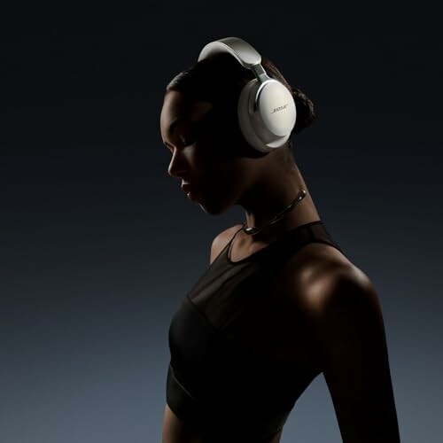 Silhouette of a person wearing white headphones